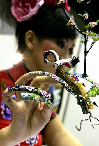 Singapore Nail Art. A model shows off her elaborately decorated fingernails