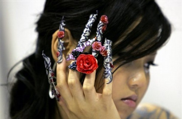 Singapore Nail Art. A model shows off her elaborately decorated fingernails